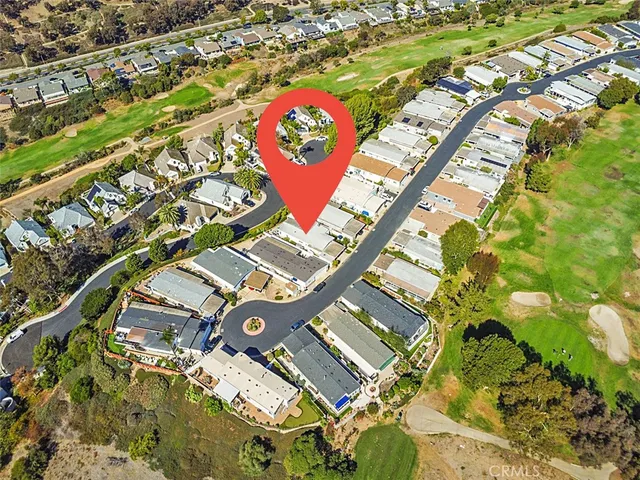 an aerial view of a house with a garage