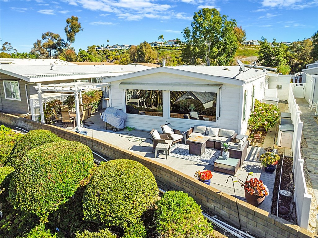 26 Mira Las Olas San Clemente, CA 92673 - Photo 32 of 34 an outdoor living area with furniture and a fireplace