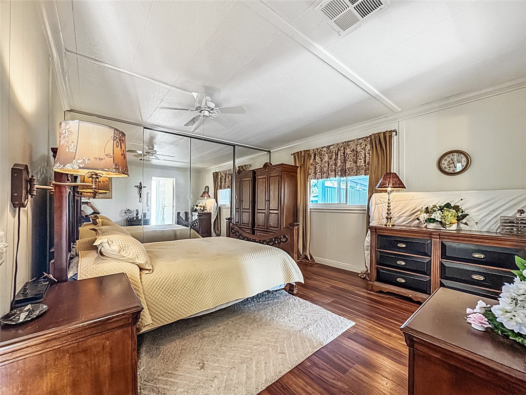 26 Mira Las Olas San Clemente, CA 92673 - Photo 5 of 34 a bedroom with a bed and a flat tv screen on wall