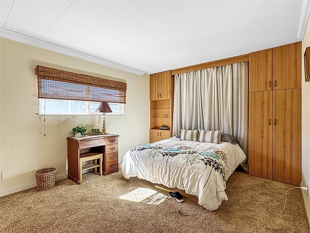 26 Mira Las Olas San Clemente, CA 92673 - Photo 7 of 34 a bedroom with a bed and a window