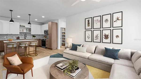 a living room with furniture and a large window