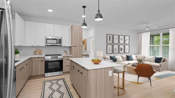 a kitchen with sink a stove and chairs