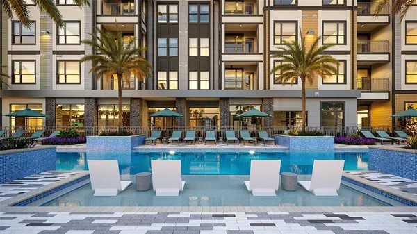 a view of a patio with couches table and chairs and potted plants