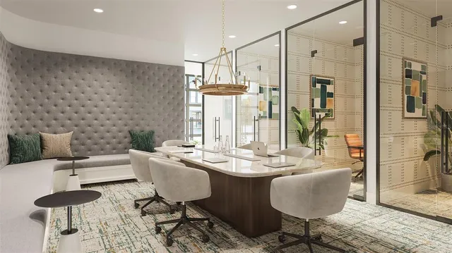 a dining room with furniture and wooden floor