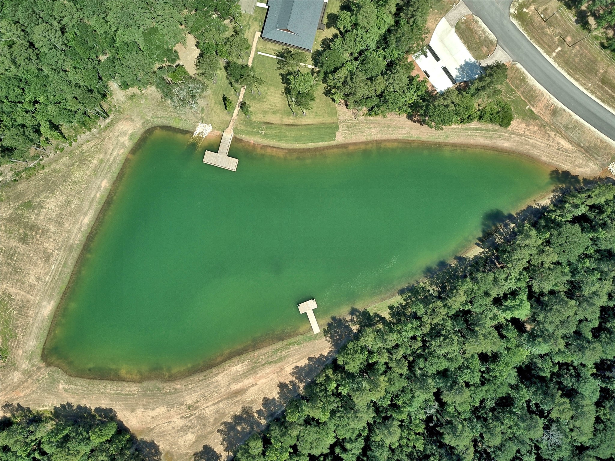 258 Heartland Road New Waverly, TX 77358 - Photo 8 of 27 Community Pond Aerial View