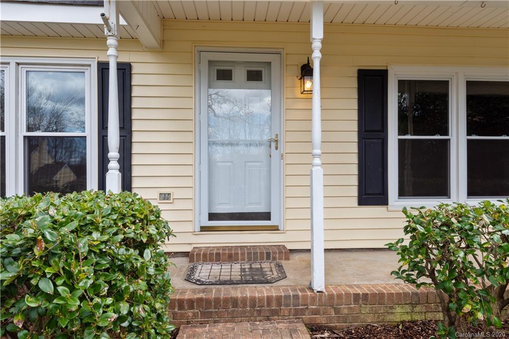 10602 Fairway Ridge Road Charlotte, NC 28277 - Photo 2 of 32 a front view of a house with a garden