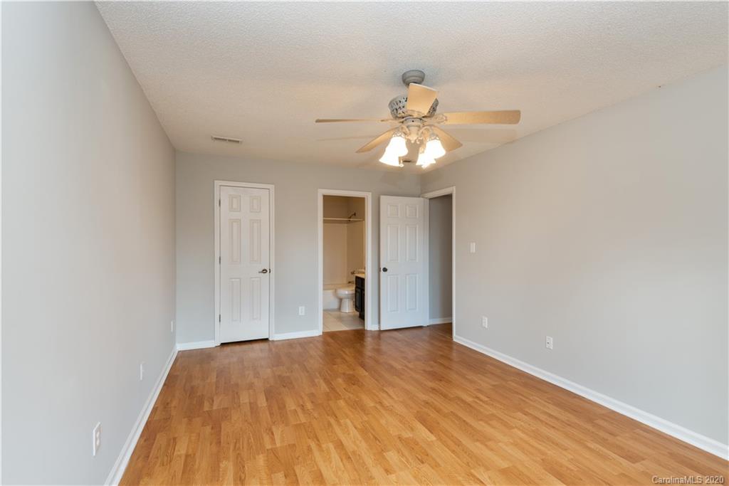 10602 Fairway Ridge Road Charlotte, NC 28277 - Photo 14 of 32 a view of a bedroom with a large bed