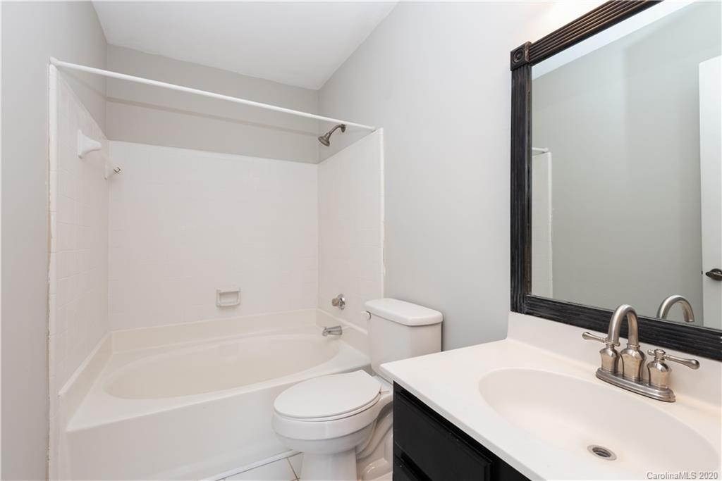10602 Fairway Ridge Road Charlotte, NC 28277 - Photo 18 of 32 a bathroom with a sink toilet and shower