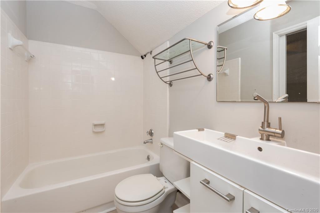 10602 Fairway Ridge Road Charlotte, NC 28277 - Photo 27 of 32 a bathroom with a sink toilet vanity and shower