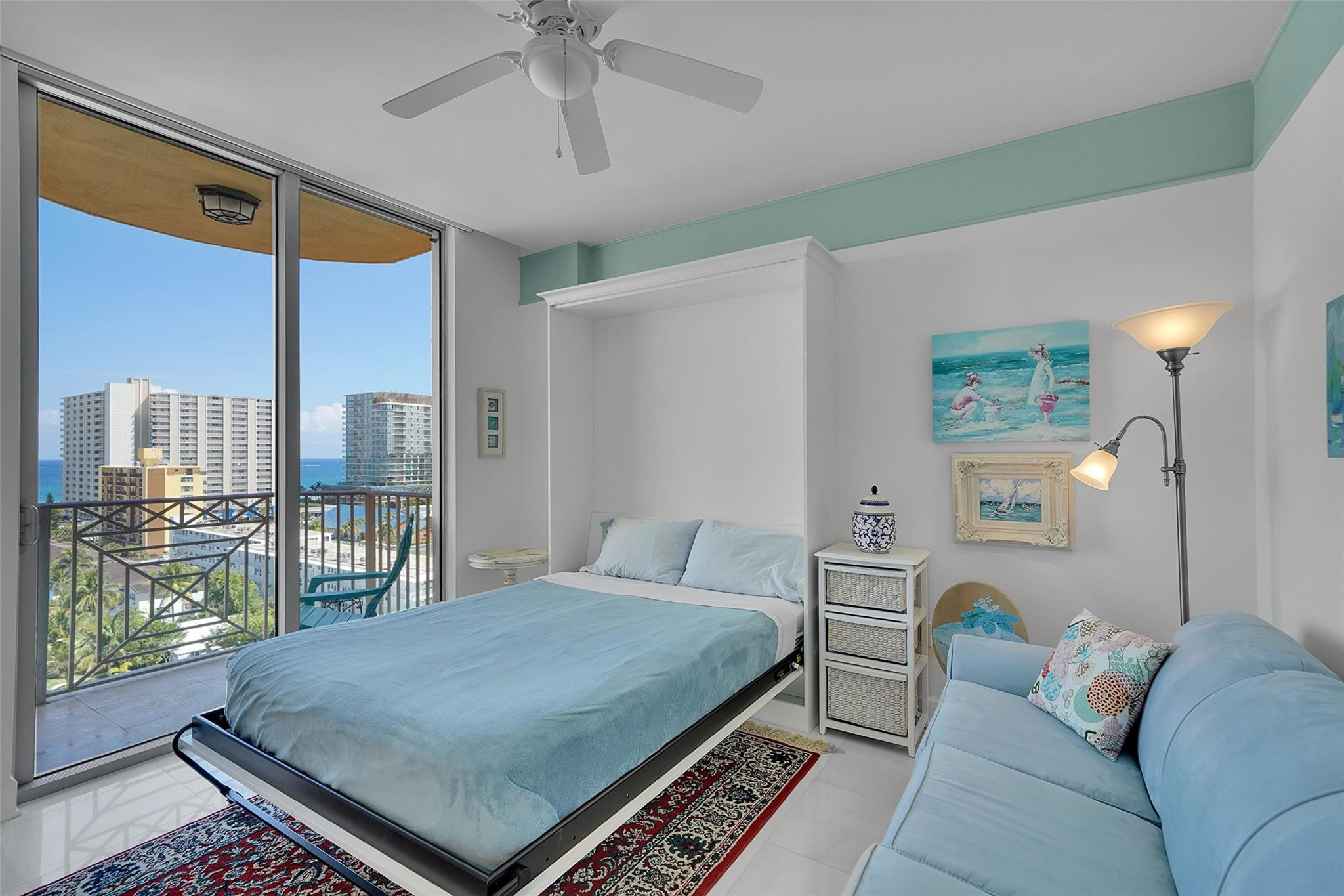 821 North Riverside Drive, Unit PH2 Pompano Beach, FL 33062 - Photo 60 of 95 a bed room with a bed and a large window