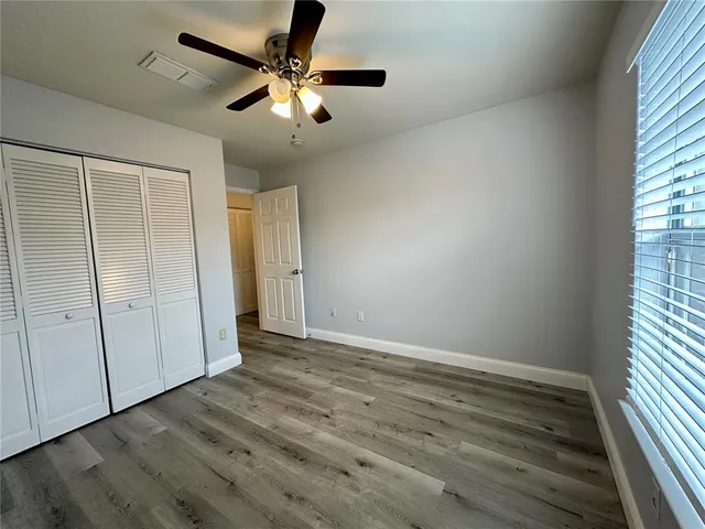 a bathroom with a sink a toilet a mirror and shower