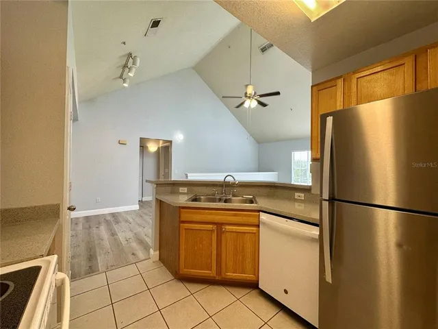 a kitchen with a refrigerator and countertop
