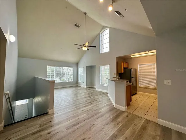 a view of kitchen with cabinets and wooden floor