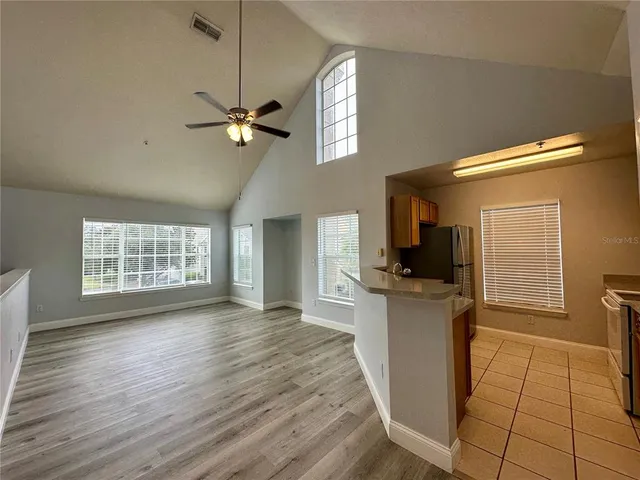 a kitchen with stainless steel appliances granite countertop a stove and a refrigerator