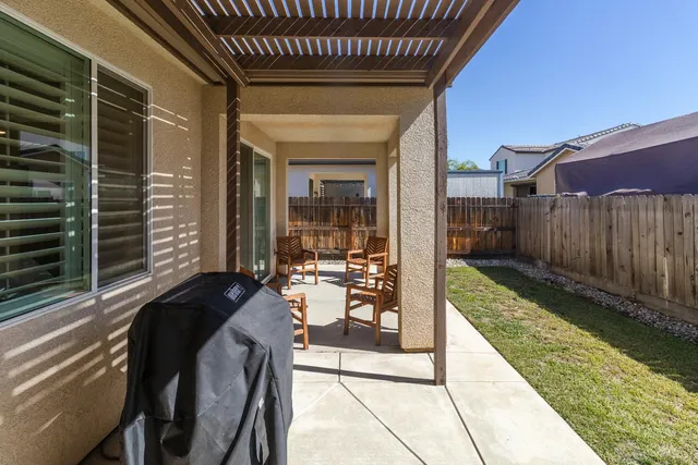 a house view with a backyard space