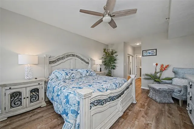 a bedroom with furniture and flat screen tv