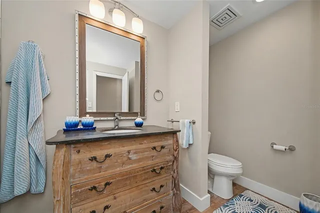 a view of a room with furniture and wooden floor