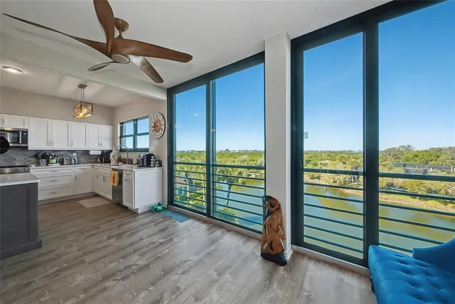 a building outdoor space with patio furniture and glass door