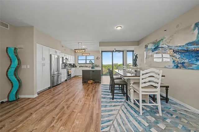 a view of a dining room with furniture and a rug