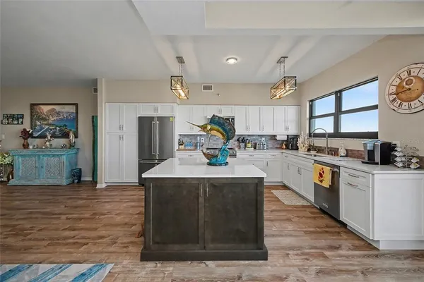 a kitchen with a sink and a large window