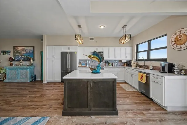 a kitchen with a sink and a large window