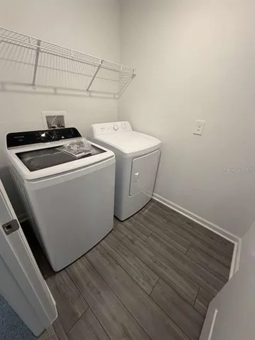 a utility room with dryer and washer
