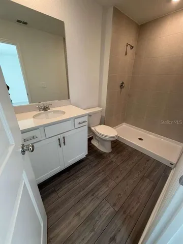 a bathroom with a sink and mirror