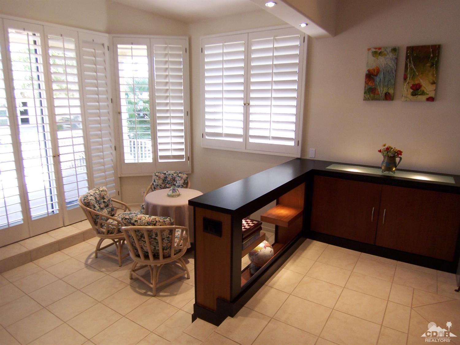 195 Desert Lakes Drive Rancho Mirage, CA 92270 - Photo 11 of 28 a kitchen with a stove and a cabinets