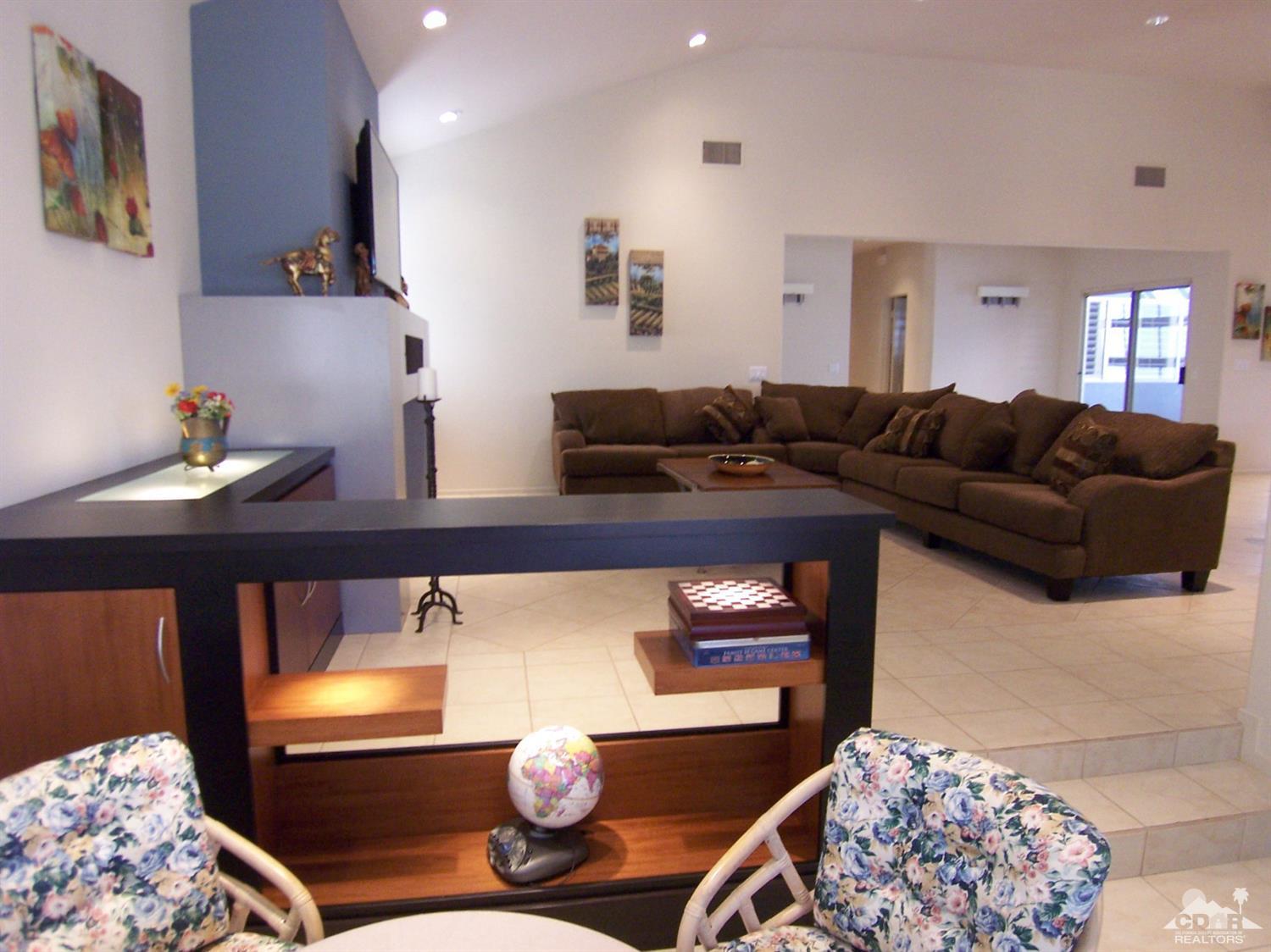 195 Desert Lakes Drive Rancho Mirage, CA 92270 - Photo 12 of 28 a living room with furniture and a couch