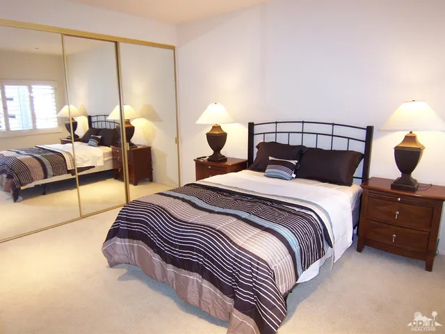 a bedroom with a bed and a view of bathroom