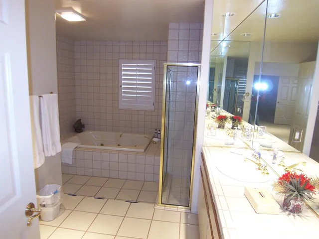 a bathroom with a bathtub and shower