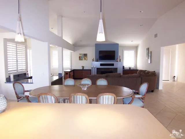 a view of living room kitchen and dining room