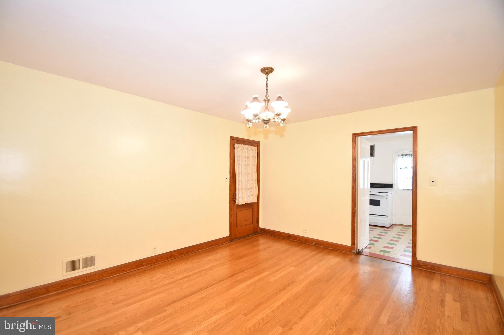 7009 Mornington Road Dundalk, MD 21222 - Photo 16 of 48 a view of a room with wooden floor and cabinet