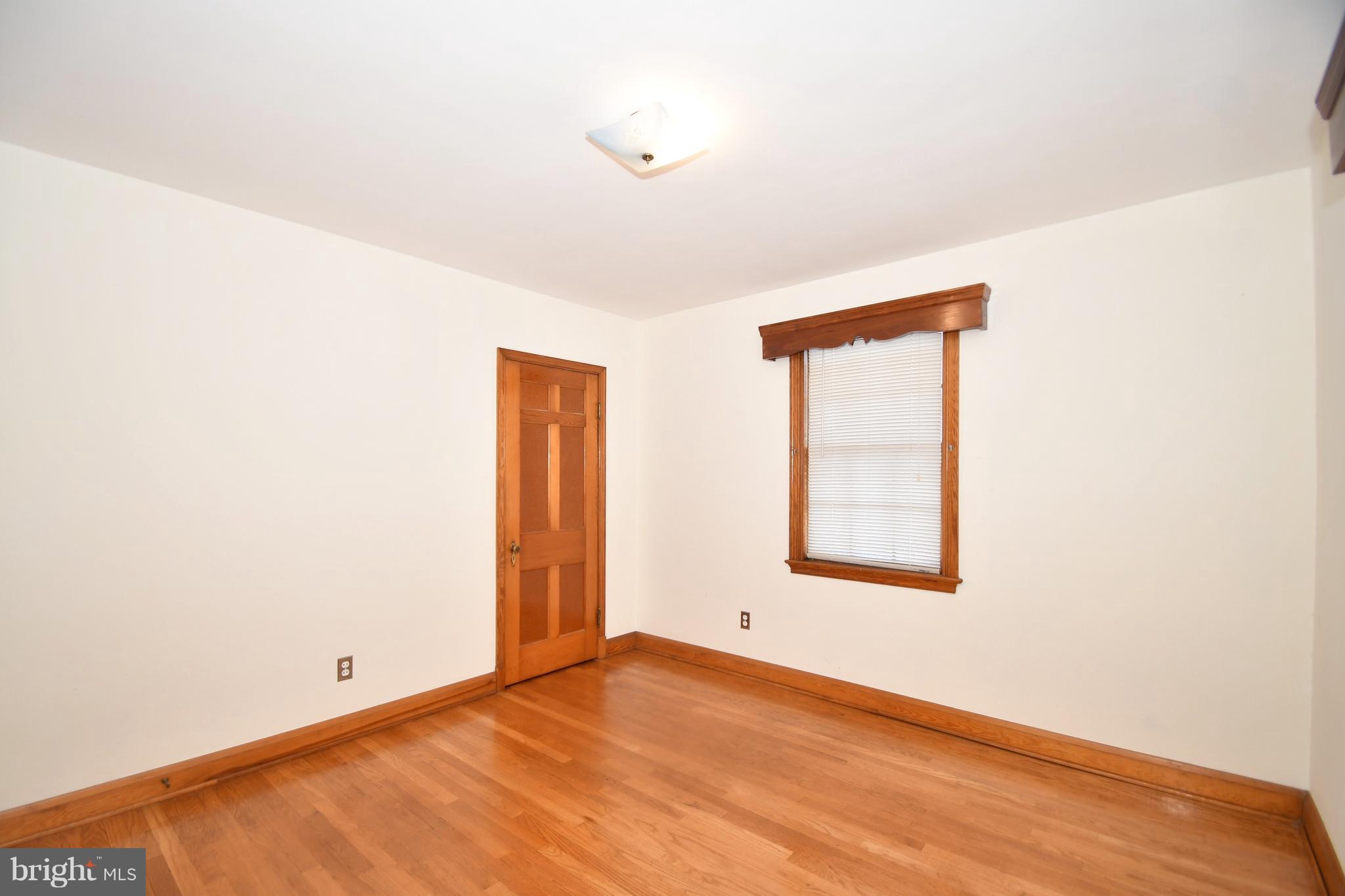 7009 Mornington Road Dundalk, MD 21222 - Photo 29 of 48 a view of an empty room with a window