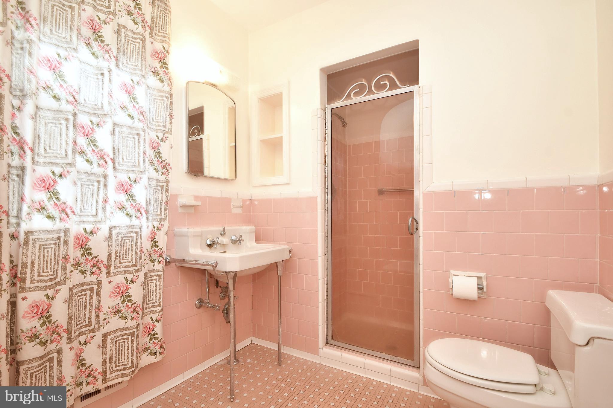 7009 Mornington Road Dundalk, MD 21222 - Photo 32 of 48 a bathroom with a sink a toilet and shower curtain