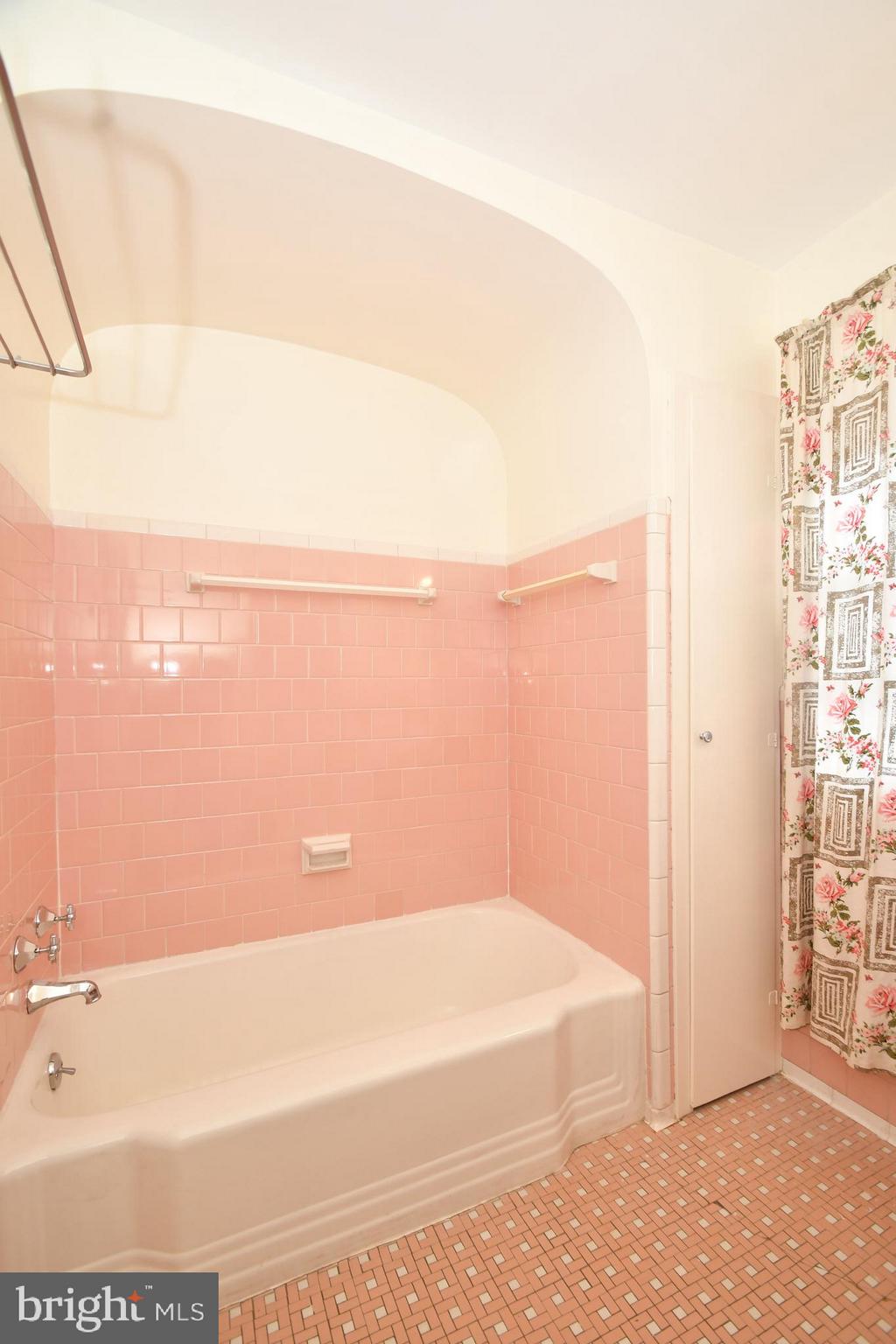 7009 Mornington Road Dundalk, MD 21222 - Photo 33 of 48 a bathroom with a bathtub and a shower