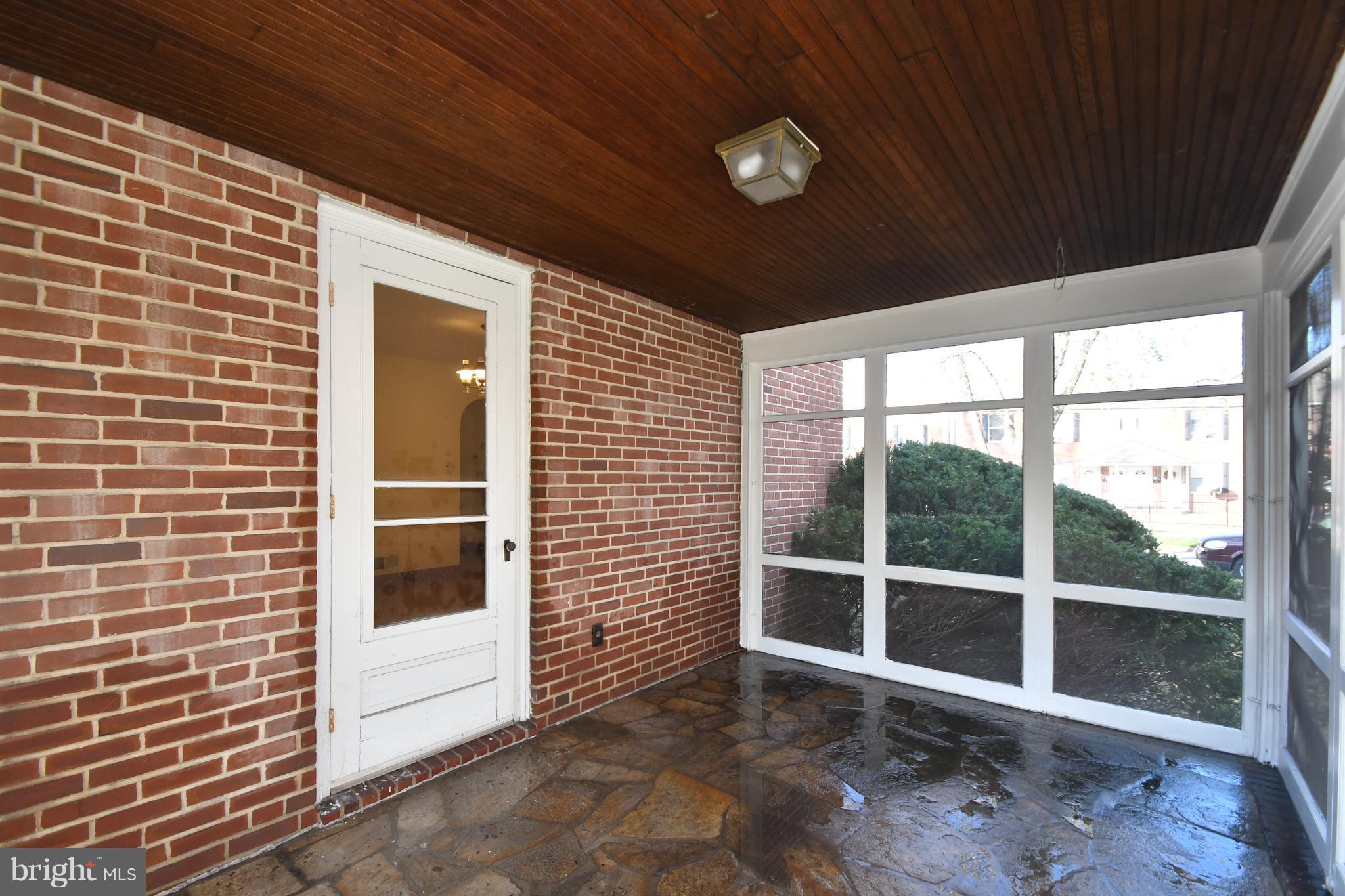 7009 Mornington Road Dundalk, MD 21222 - Photo 35 of 48 a view of a porch with a door