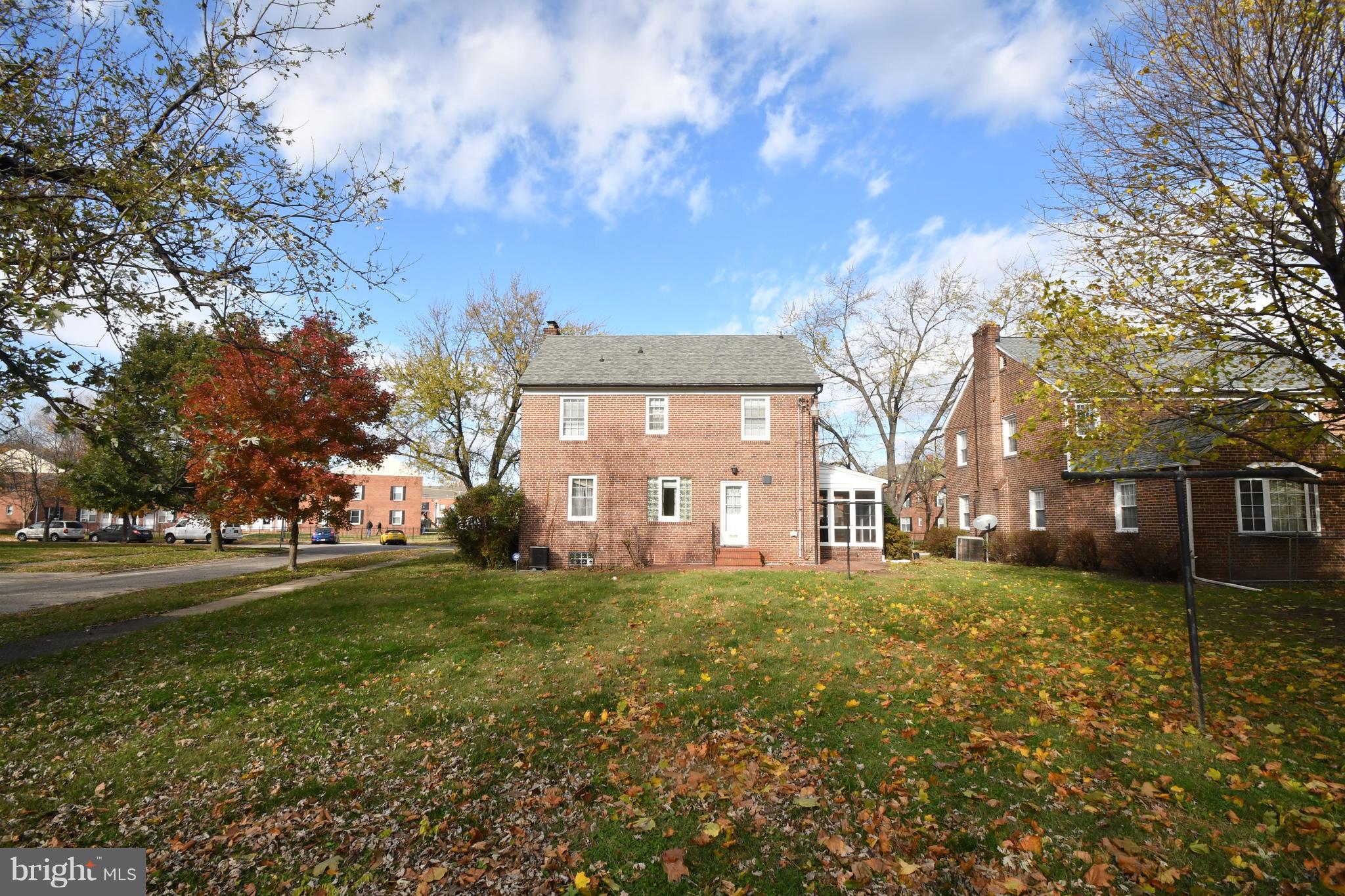 7009 Mornington Road Dundalk, MD 21222 - Photo 40 of 48 a large house with a big yard and large trees