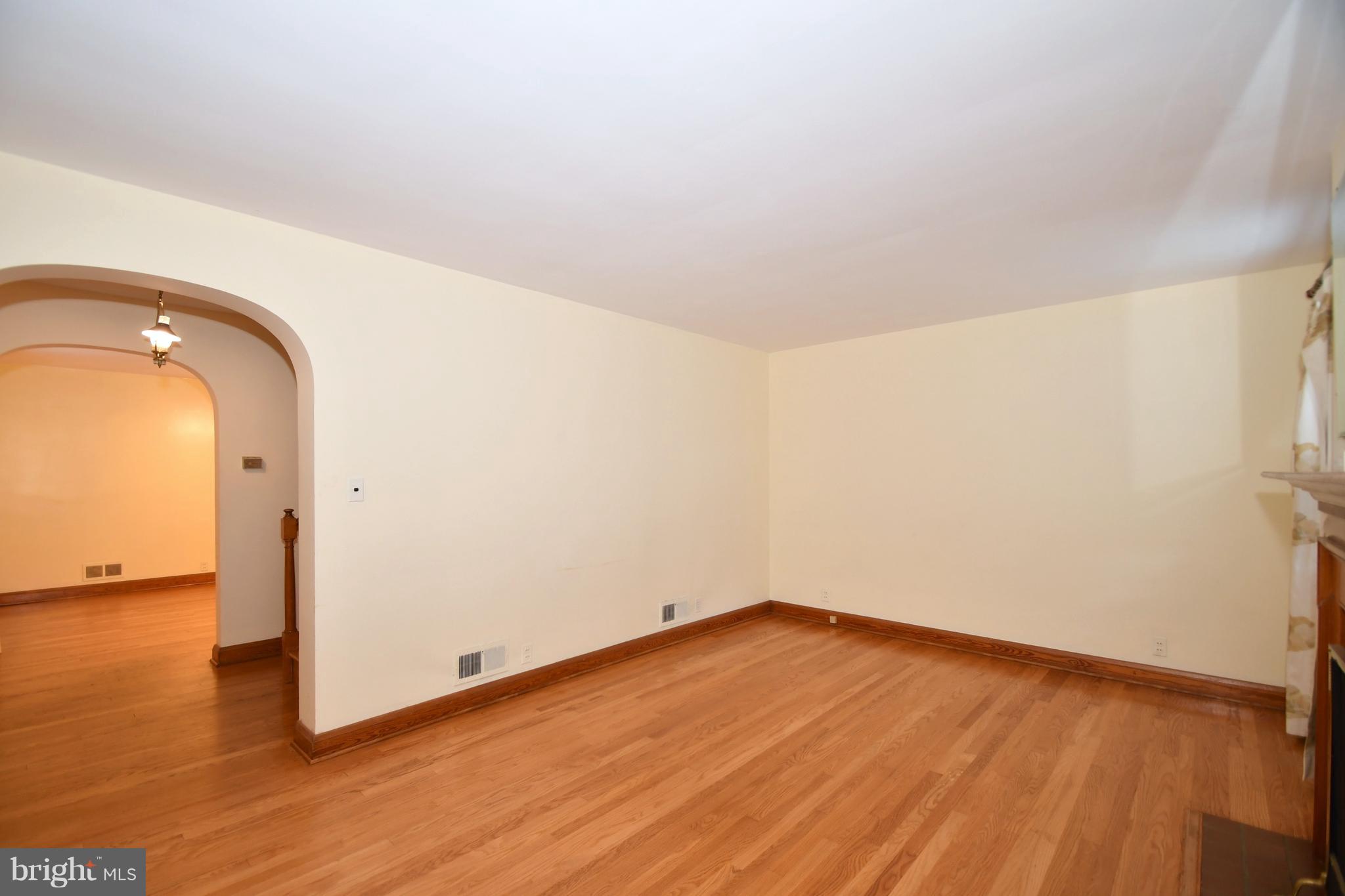 7009 Mornington Road Dundalk, MD 21222 - Photo 8 of 48 a view of empty room with wooden floor and fan