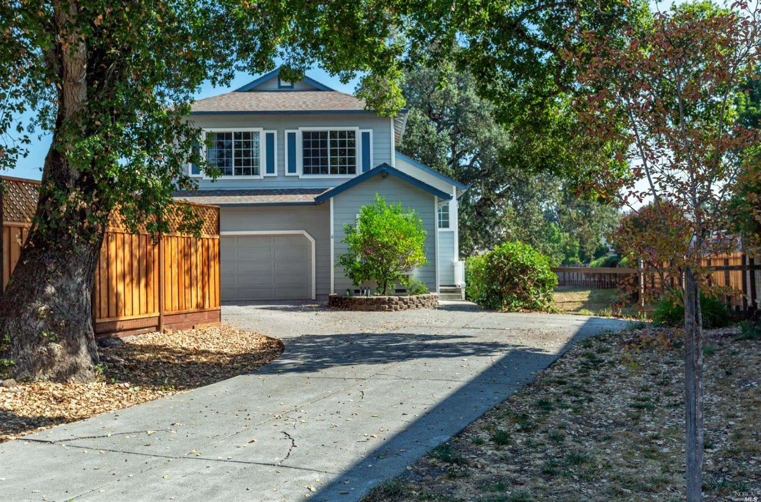 1362 Cadence Way Santa Rosa, CA 95403 - Photo 1 of 1 a front view of a house with a yard and garage