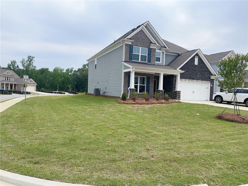 a front view of a house with garden