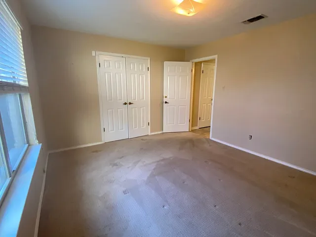 an empty room with windows