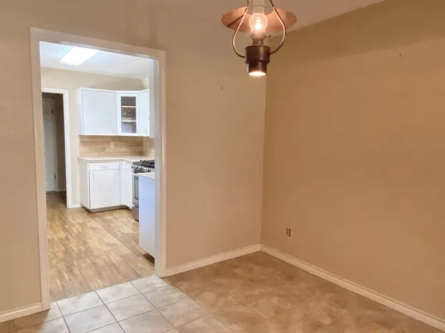 a view of a kitchen cabinets and a stove