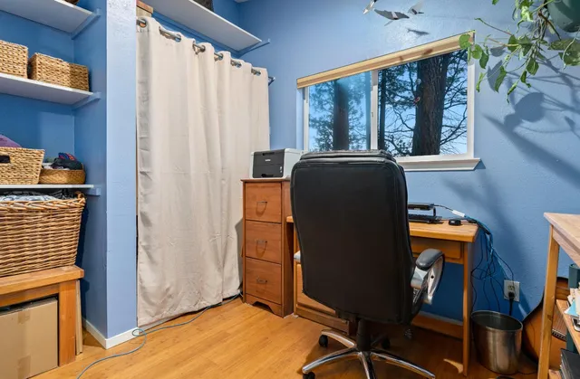 a bedroom with a bed and a lounge chair