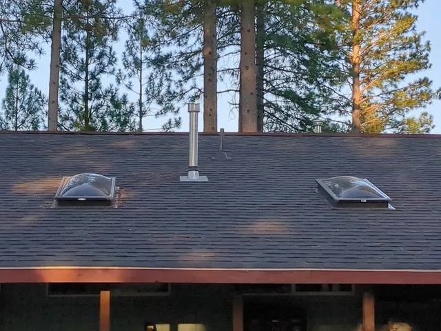 a view of a backyard with sitting area