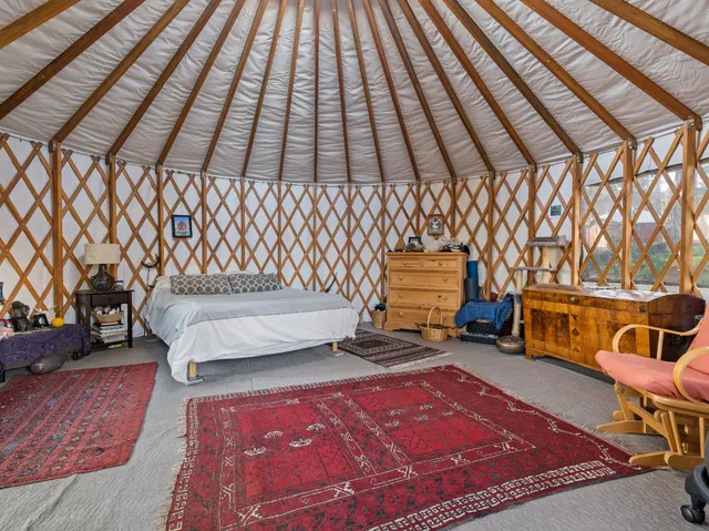 a view of a forest with a street