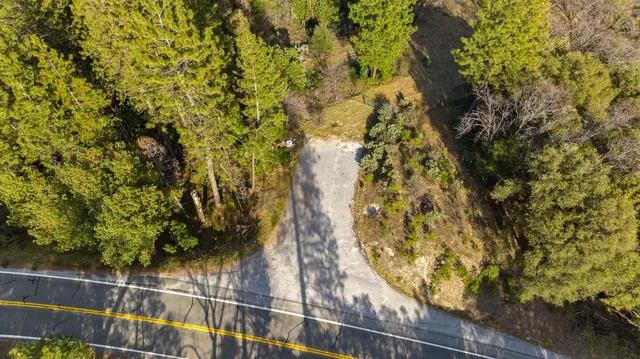 a backyard of a house with a yard and outdoor seating