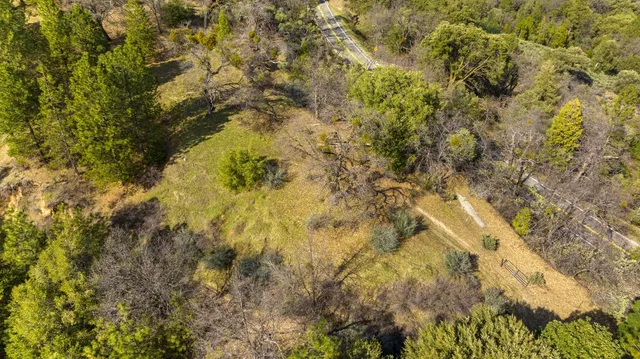 a kitchen that has a table chairs and wooden floor