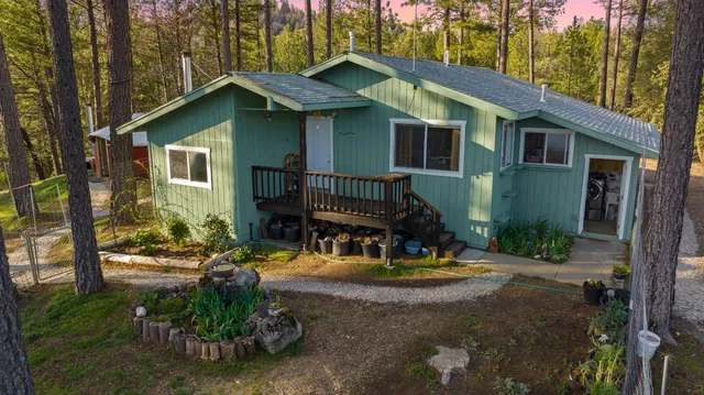 a living room with furniture and a book shelf