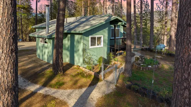 a bathroom with a granite countertop toilet sink and mirror